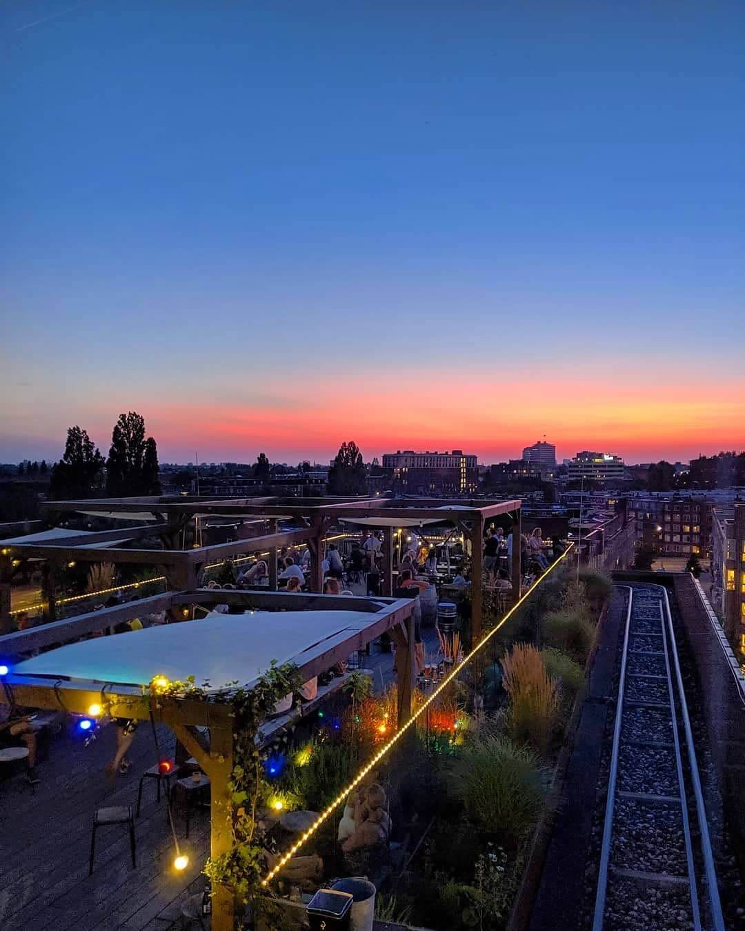 rooftop bar hang-out amsterdam sunset drinks bites 